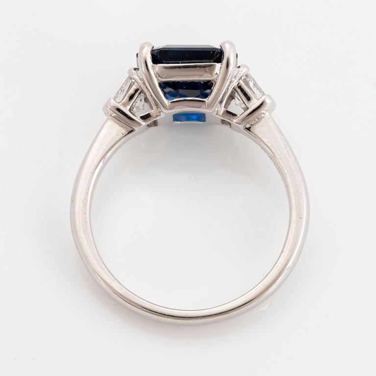 A platinum ring set with a step-cut sapphire weight 4.58 cts.