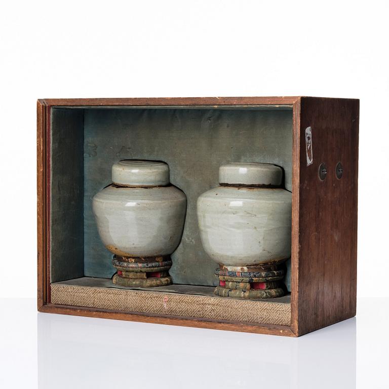 A pair of Japanese celadon jars with cover, Edo period (1603-1868).