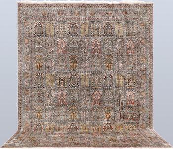 A Kashmir silk carpet, 418 x 297 cm.