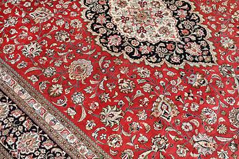A silk Ghom carpet, c. 346 x 247 cm.