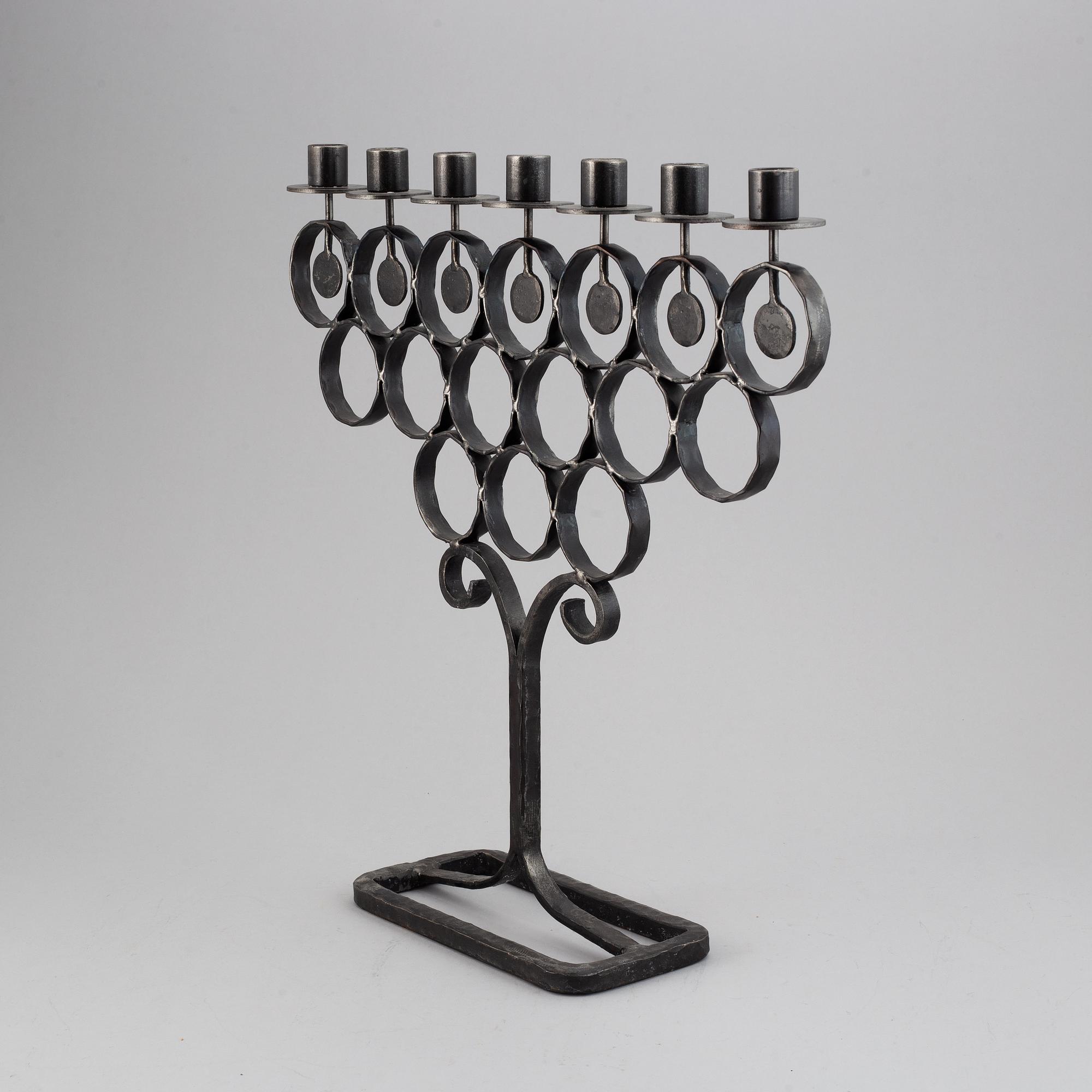 A cast iron candelabra by Bertil Vallien for Kosta Smide, Sweden.