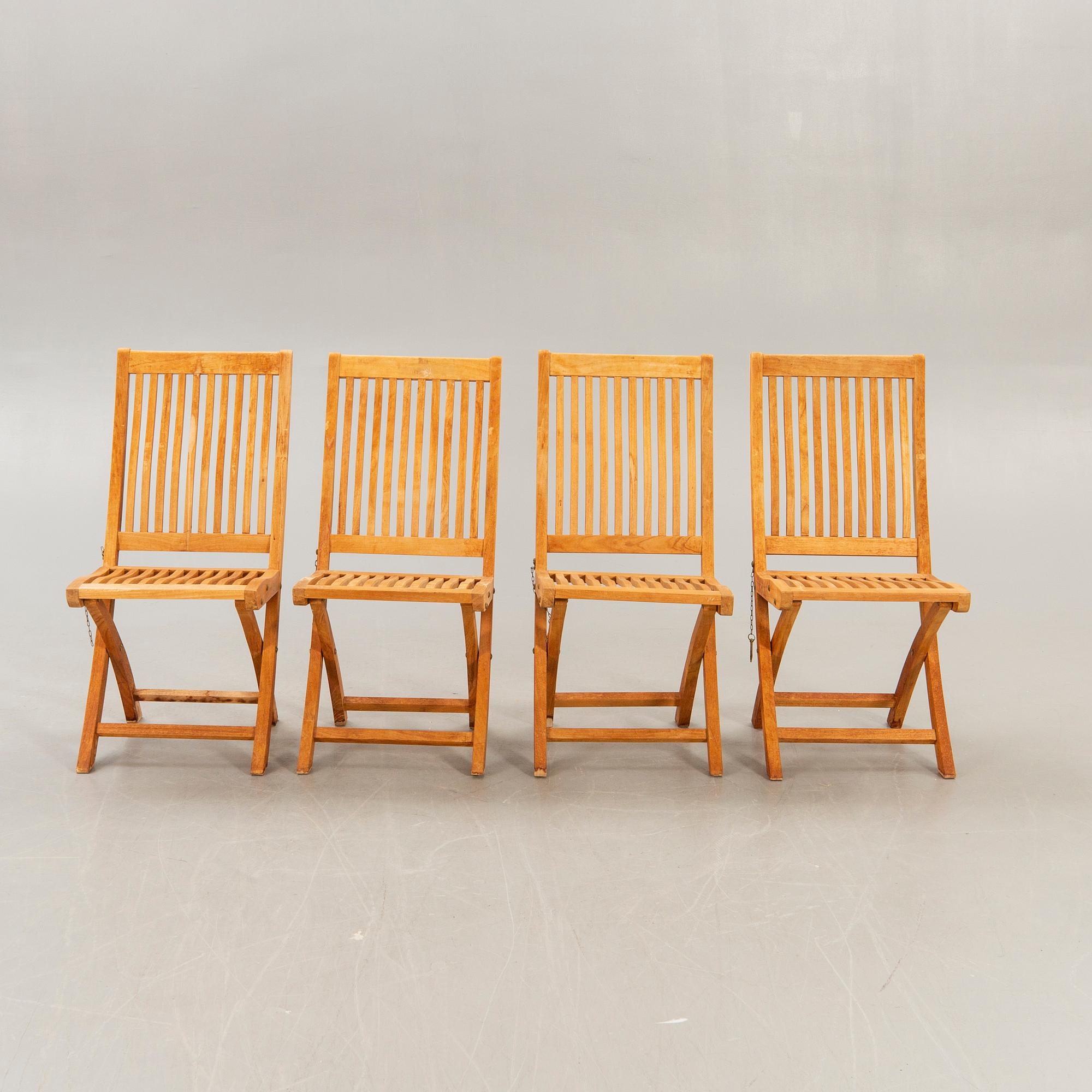 A set of four chairs and a table Royal teak and others, later part of the 20th century.
