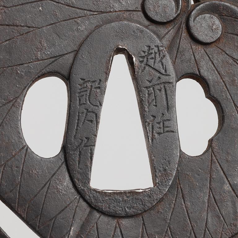 Tsuba, Japan, signed Echizen Ju Kinai, mid-1600s.