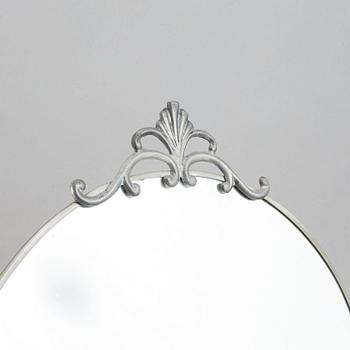 A set of a pewter mirror and two girandole mirrors.