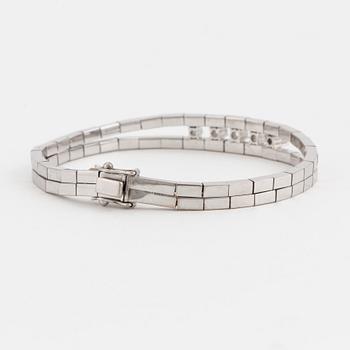 An Omega-link bracelet set with round, brilliant-cut diamonds.