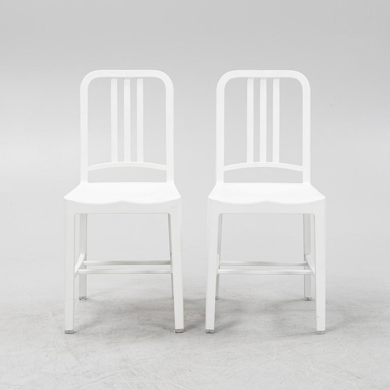 A pair of plastic 'Navy Chair' by Emeco.