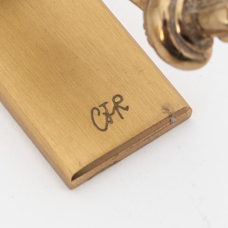 Carl Fredrik Reuterswärd, a brass 'Non violence' sculpture from Skultuna, signed.