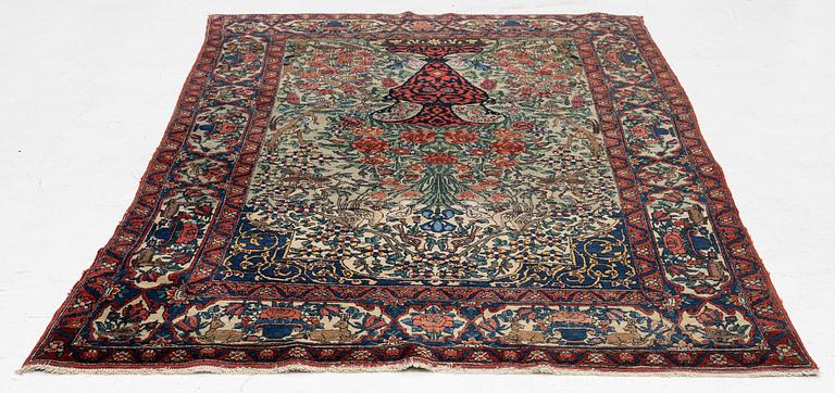 A figural oriental rug, c.. 230 x 130 cm.