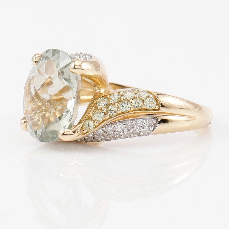 RING, 10K guld, kvarts, peridoter och diamanter tot ca 0.25 ct.
