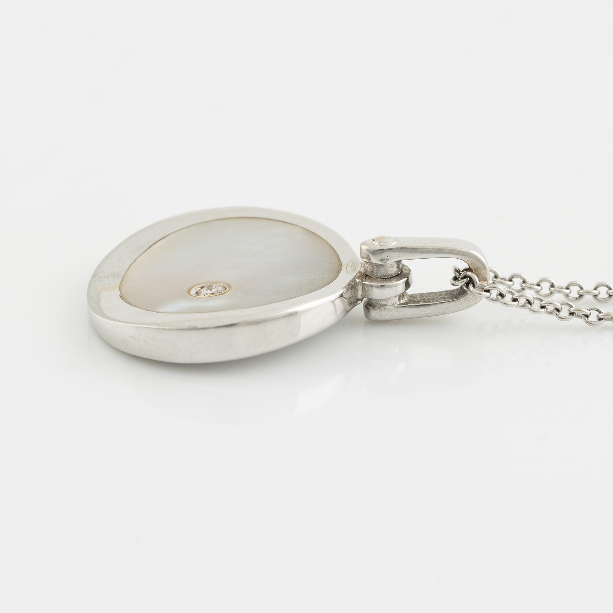 White gold, mother of pearl and round brilliant cut diamond necklace.