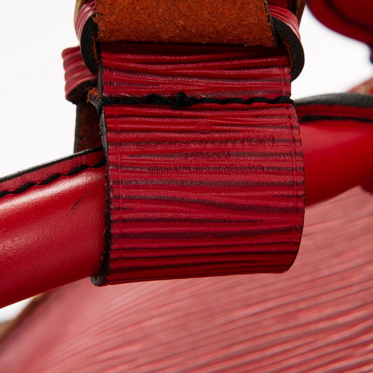 A RED EPI LEATHER KEEPALL TRAVEL BAG.