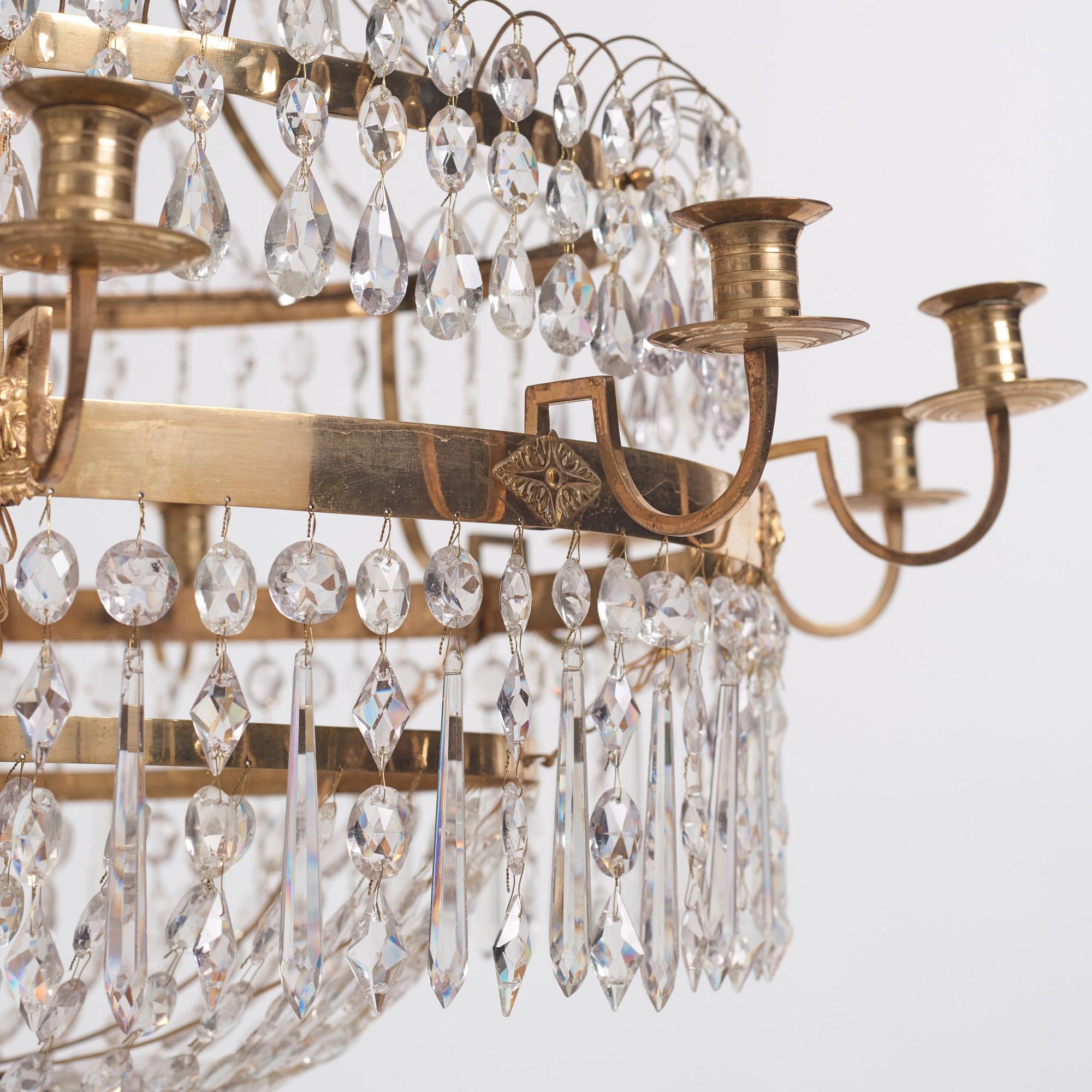A late Gustavian gilt brass and cut glass thirteen-light chandelier, circa 1800.