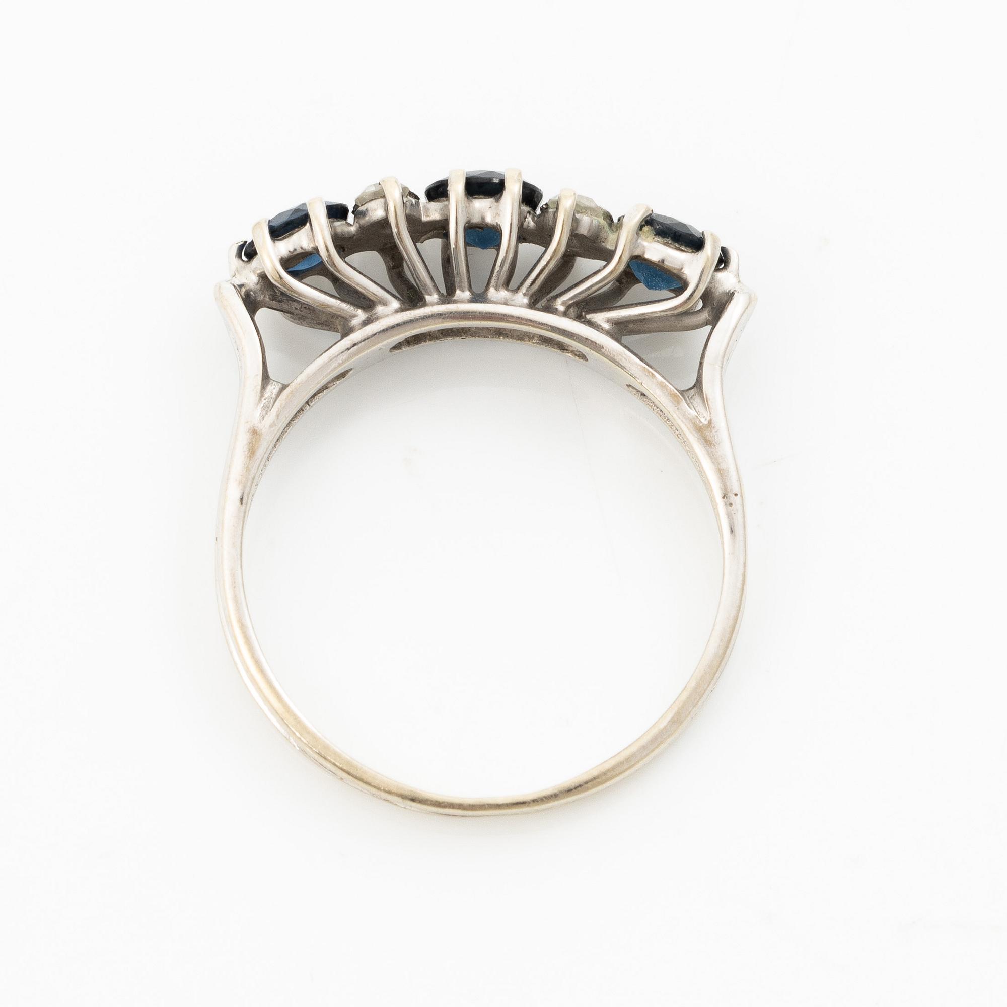 Ring, 18K white gold, set with three sapphires and single-cut diamonds.
