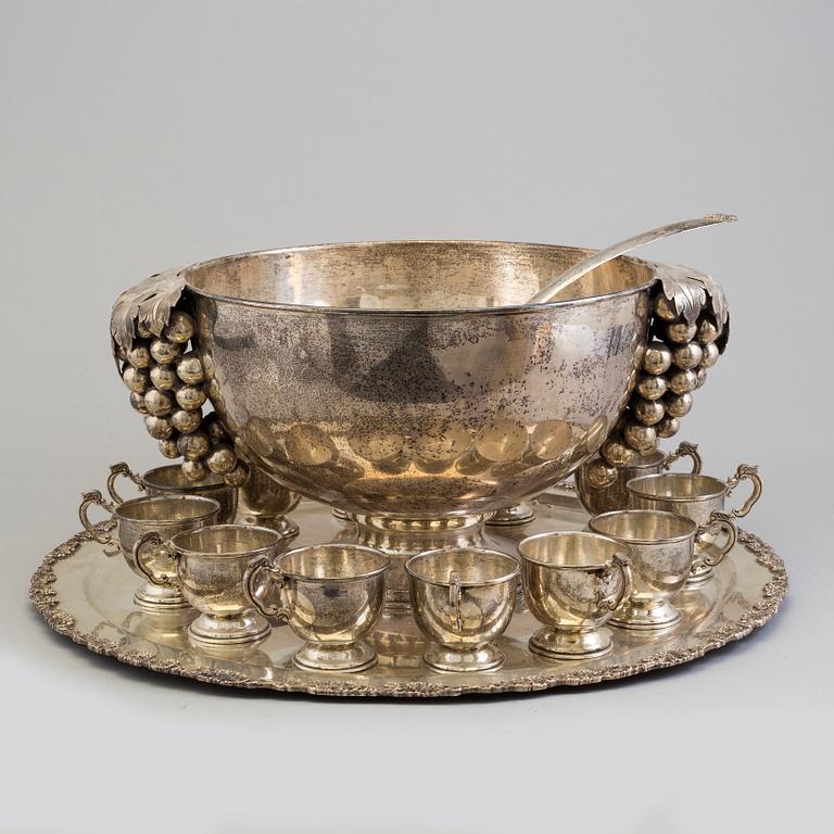 A first half of the 20th century silver punch bowl with twelve cups.