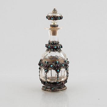 Flask with stopper, glass with mounts of partially gilded silver, late 19th century.