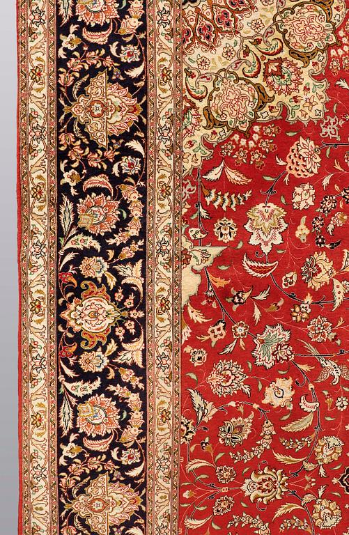 A carpet, Täbriz part silk, 341 x 248 cm.