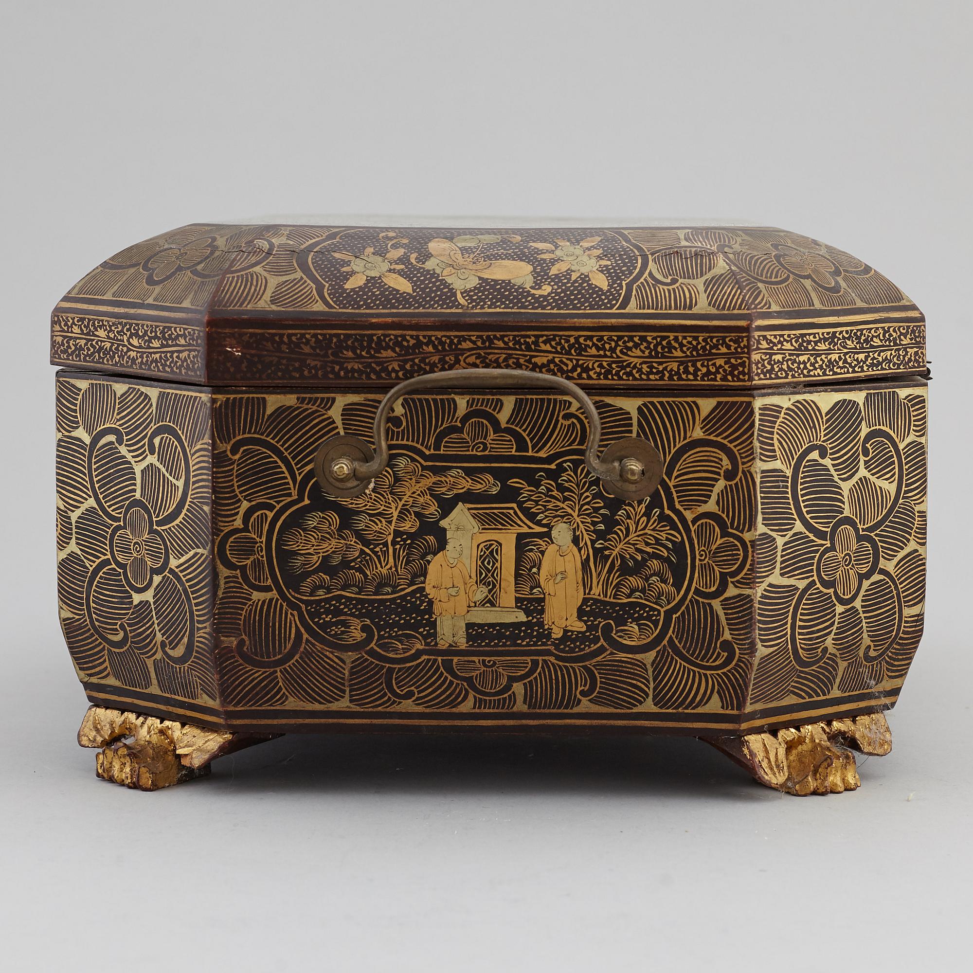 A lacquered sewing cabinet, Qing dynasty, 19th century.