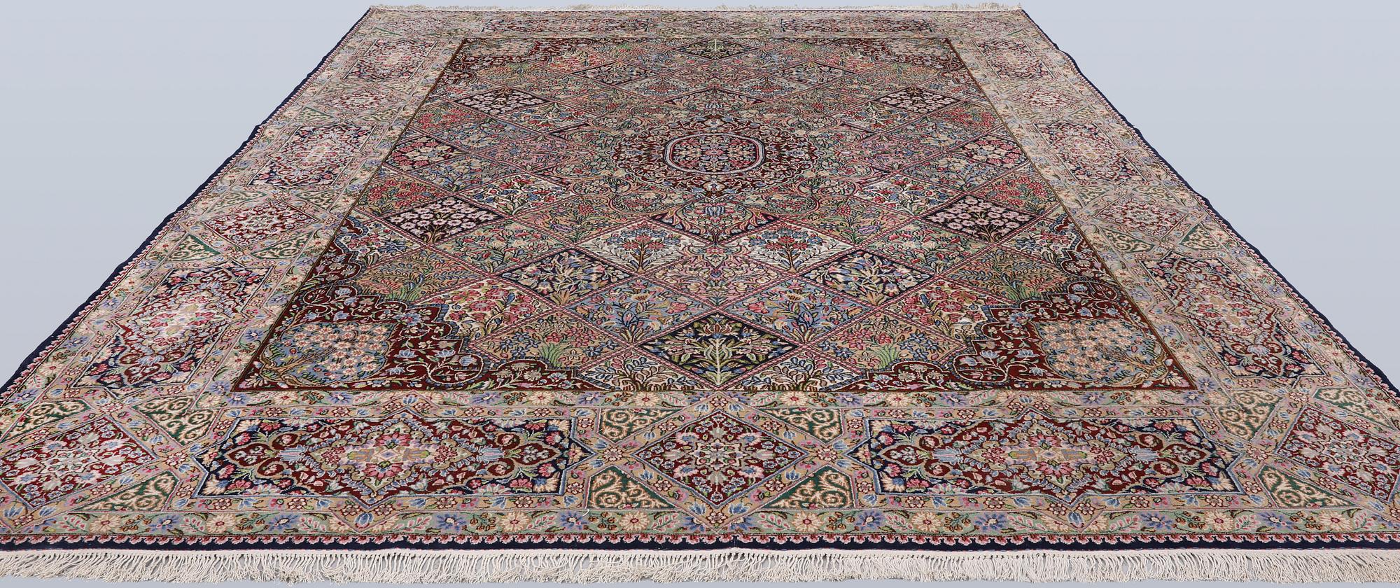 A Kirman lavash milifleur carpet, 400 x 310 cm.
