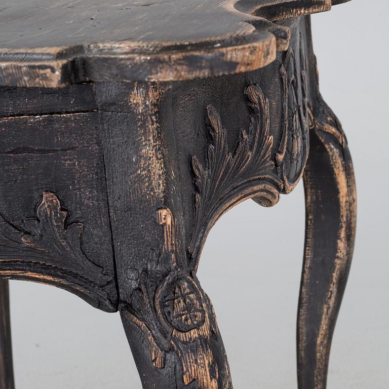 An 18h century rococo table.