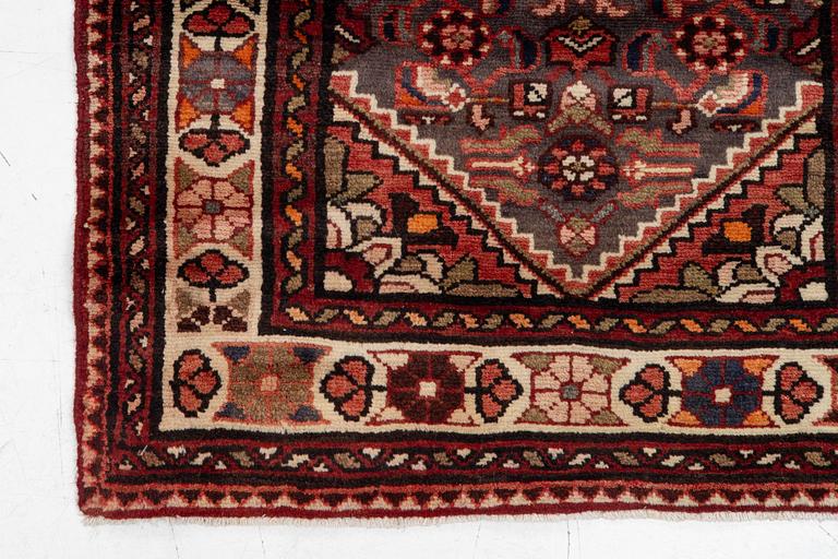 A runner  carpet, Hamadan, 305 x 80 cm.