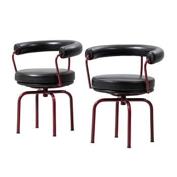 Charlotte Perriand, /Le Corbusier, swivel armchairs, a pair, model LC7, Cassina, Italy, latter half of the 20th century.