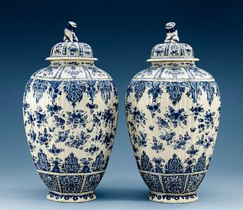 1210. A pair of French faience jars with covers, 18th Century. (2).