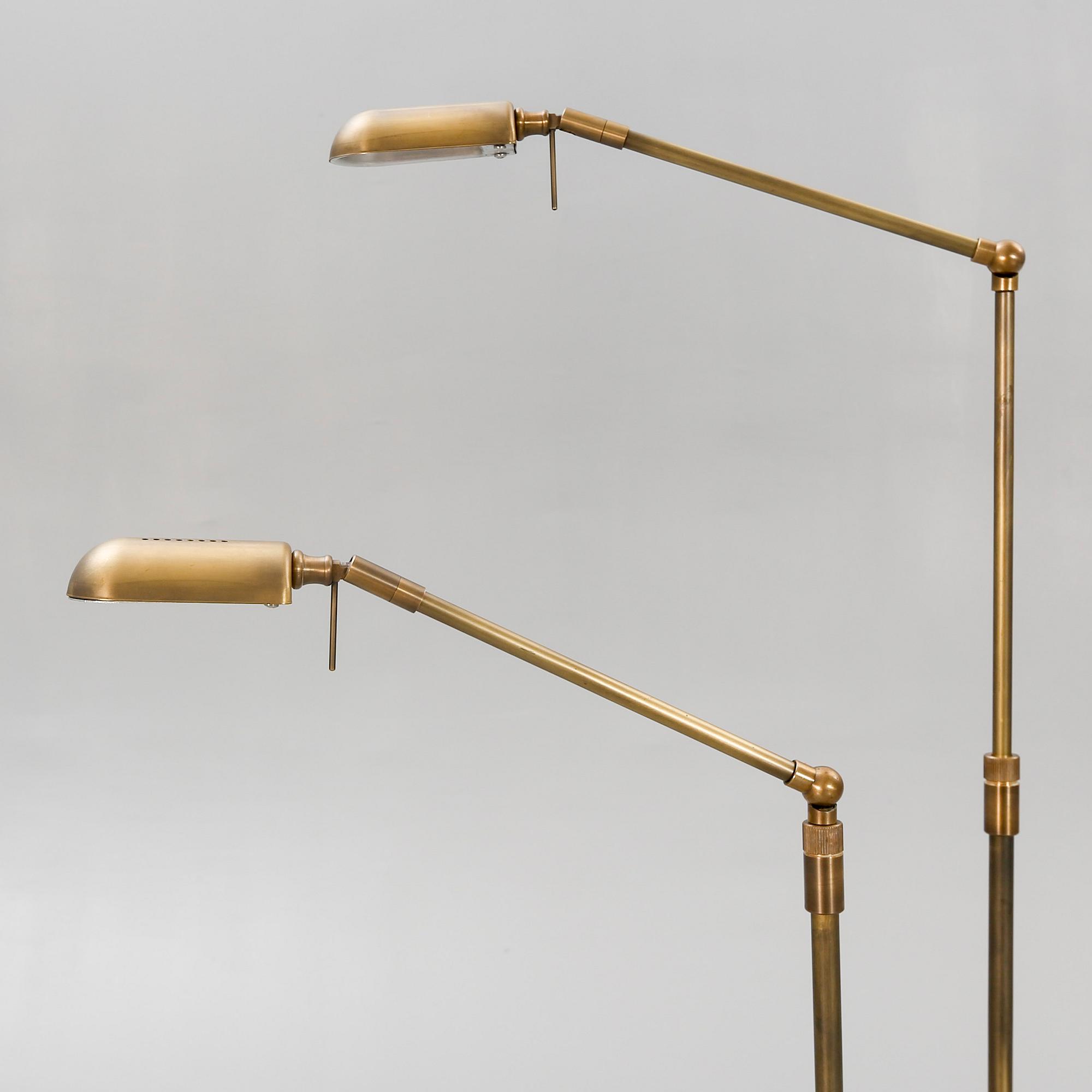 A pair of brass floor lamps 21 st century.