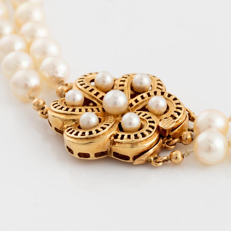 Cultured two strand pearl necklace.