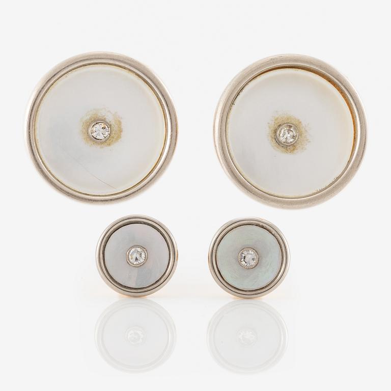 C.G Hallberg, cufflinks and shirt studs, two pairs, 18K gold with diamonds and mother-of-pearl.
