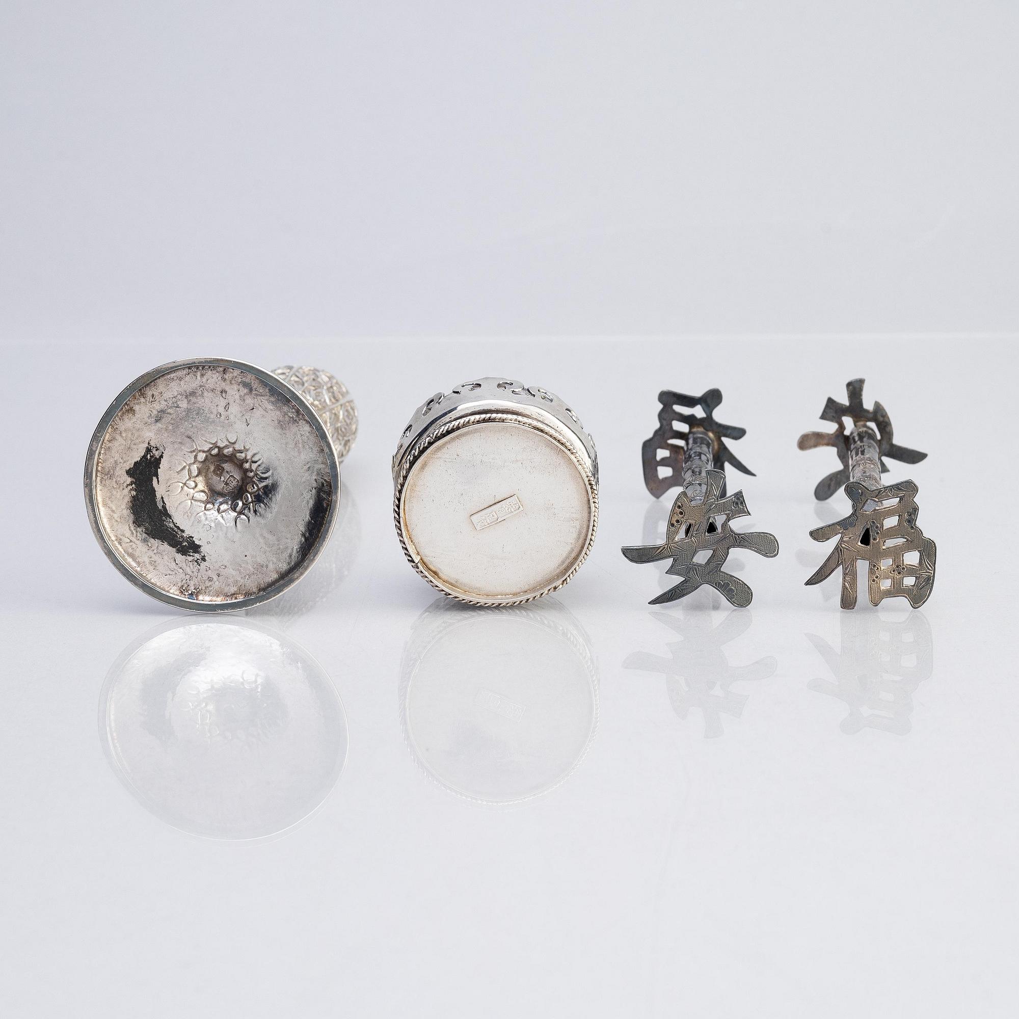 A silver bud vase, two stands for the butter knifve and a salt, China, early 20th Century.