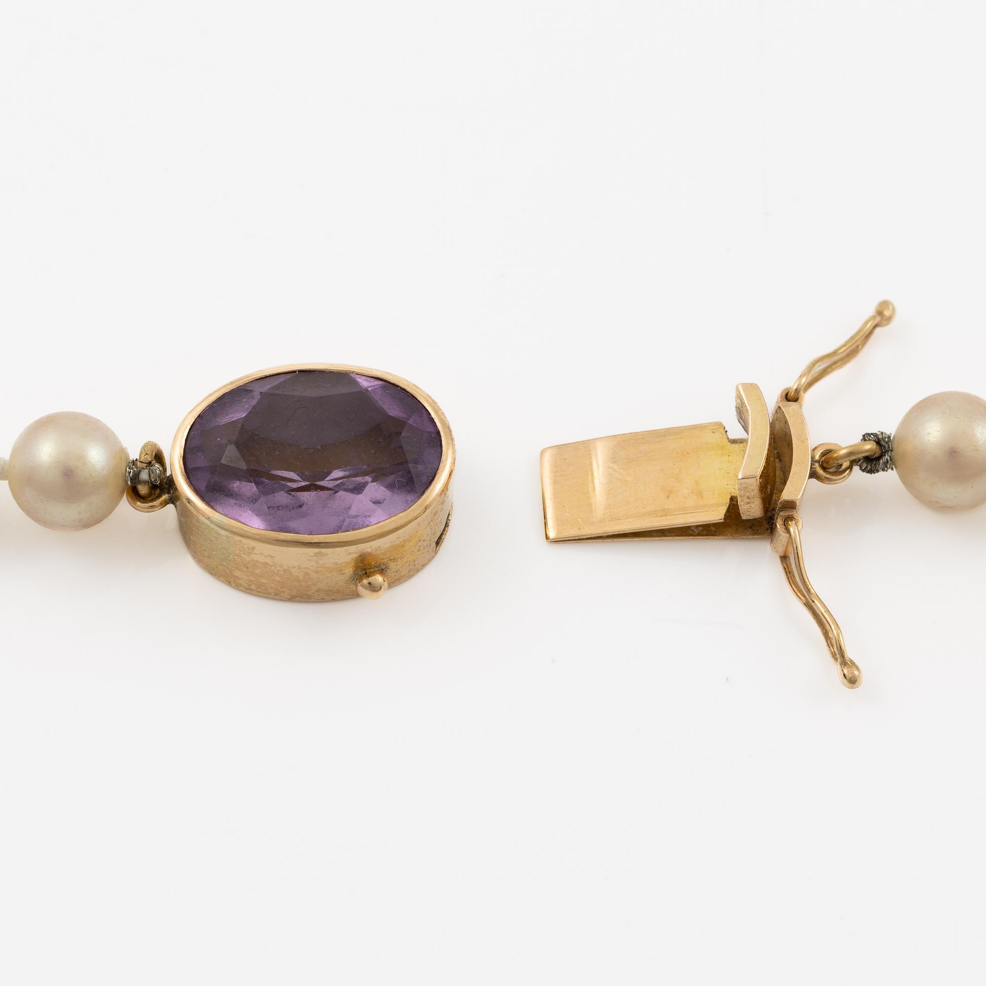 Necklace with imitation pearls, clasp 18K gold with amethyst, spacers 18K gold with pearls and diamonds.