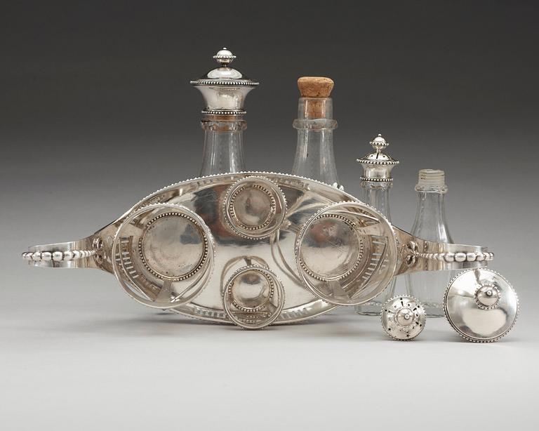 BORDSSURTOUT för fyra flaskor, av Petter Eneroth, Stockholm 1787. Gustaviansk.