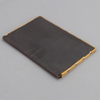 Cartier, troligen. Plånbok.