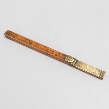 A 19th century wooden measuring stick.