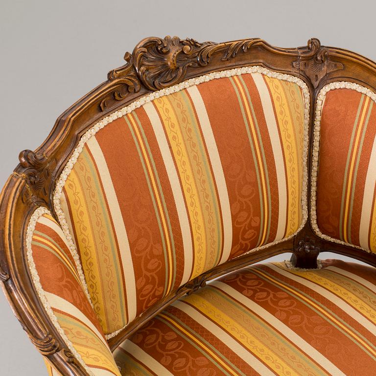 A SOFA AND A PAIR OF ARMCHAIRS, rococo style, end of 20th century.