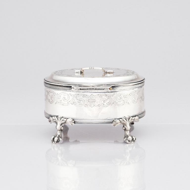 A silver suger bowl, marks of Johan Fredrik Wildt, Stockholm 1798, and a silver suger tong, Nils Arf, Stockholm 1799.