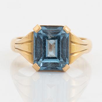 18K gold and synthetic blue spinel ring.