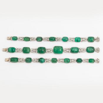 An art deco platinum necklace/bracelet combination with cabochon-cut emeralds.