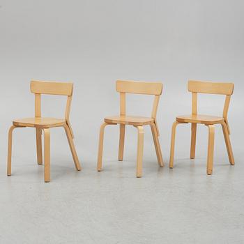 Alvar Aalto, a set of three model 69 chairs, Artek, Finland.