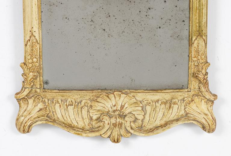 A giltwood rococo mirror, Stockholm, mid 18th century.