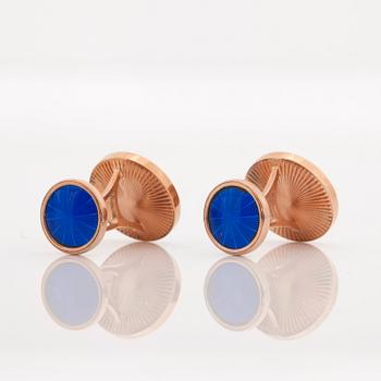 A pair of brilliant-cut diamond and blue enamel cufflinks. Total carat weight of diamonds circa 0.14 ct.