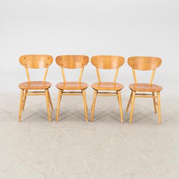 A set of four birch and teak veneered chairs from Bröderna Wigells stolfabrik, Malmbäck mid 20th century.