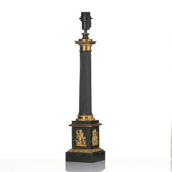 A French Empire ormolu and tole lamp, early 19th century.