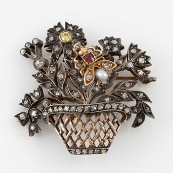 Brooch in the form of a flower basket, gold and silver with diamonds, ruby, and pearl, 19th century.