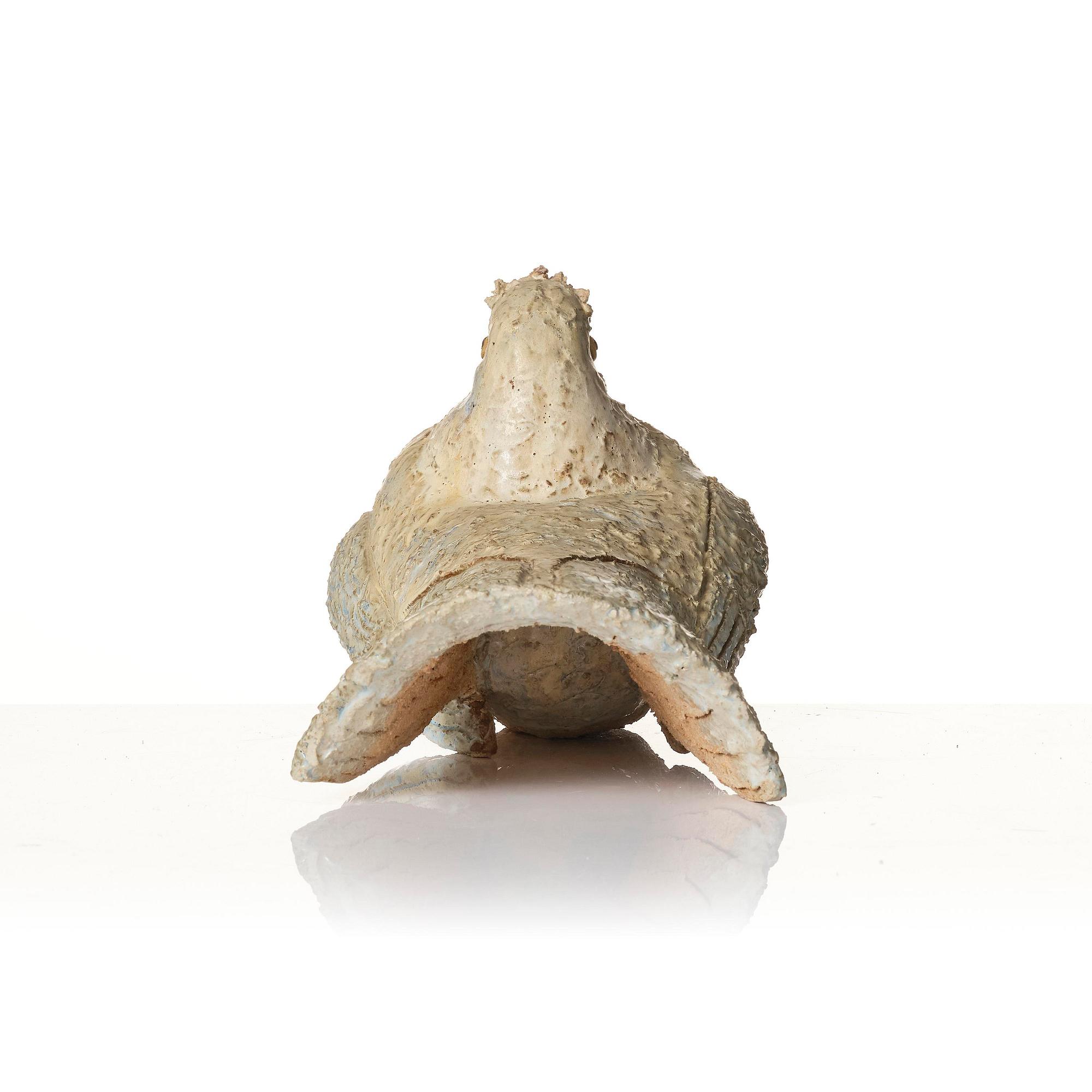 Tyra Lundgren, a chamotte stoneware sculpture of a bird, executed in her studio, Bredkvie, Gotland 1974.