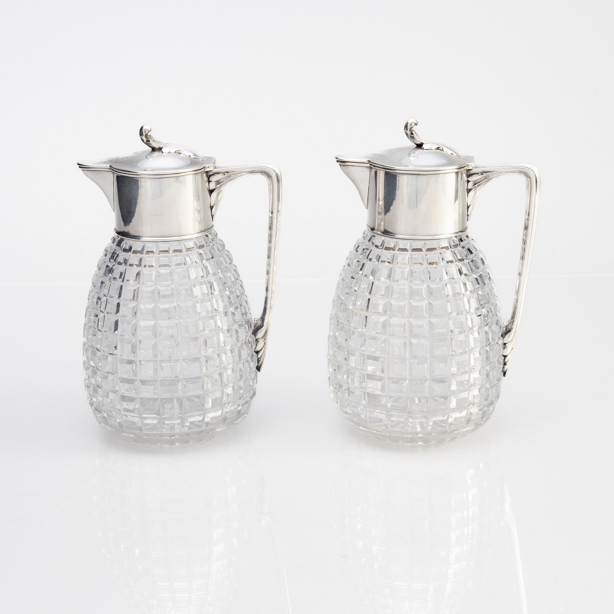 A pair of parcel-gilt silver and "hobnail" crystal decanters, W.A. Bolin, Stockholm 1920.