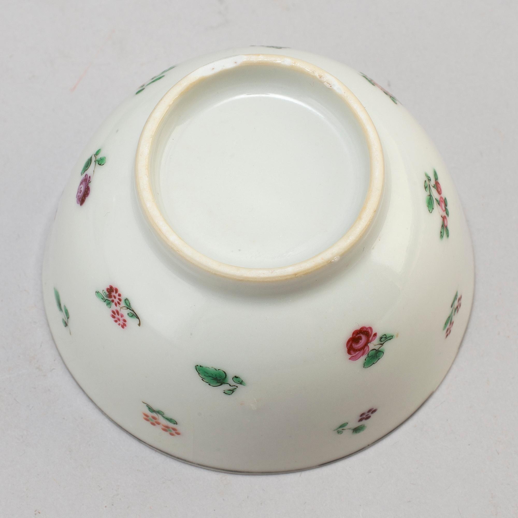 Eleven Chinese porcelian cups and saucers and two small dishes, circa 1800.