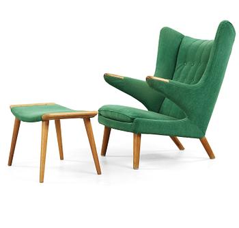84. A Hans J Wegner 'Papa bear' esy chair with ottoman, AP-stolen, Denmark 1950-60's.