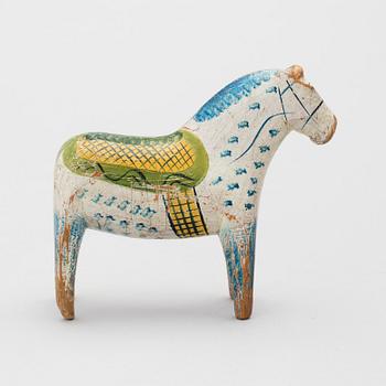 A painted folk art dala horse first half of the 20th century.