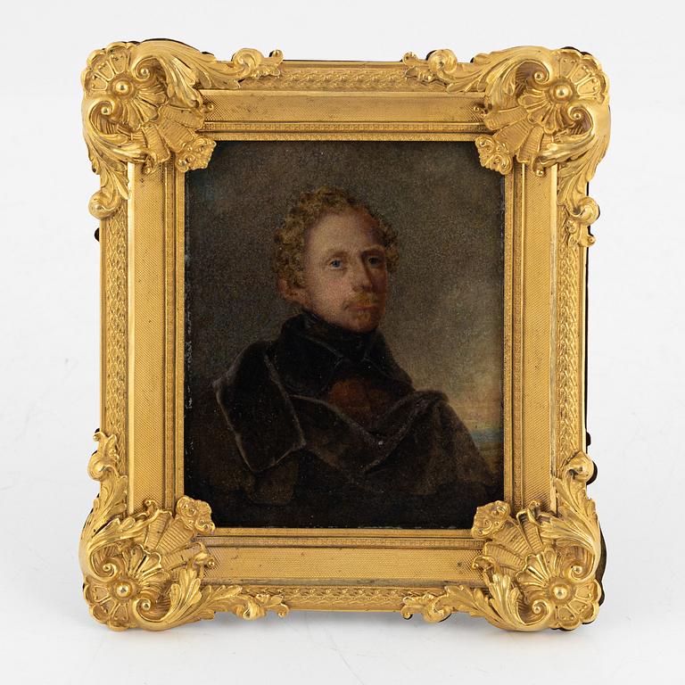 A late Empire ormolu frame with an officer's portrait, 1830's/40's.